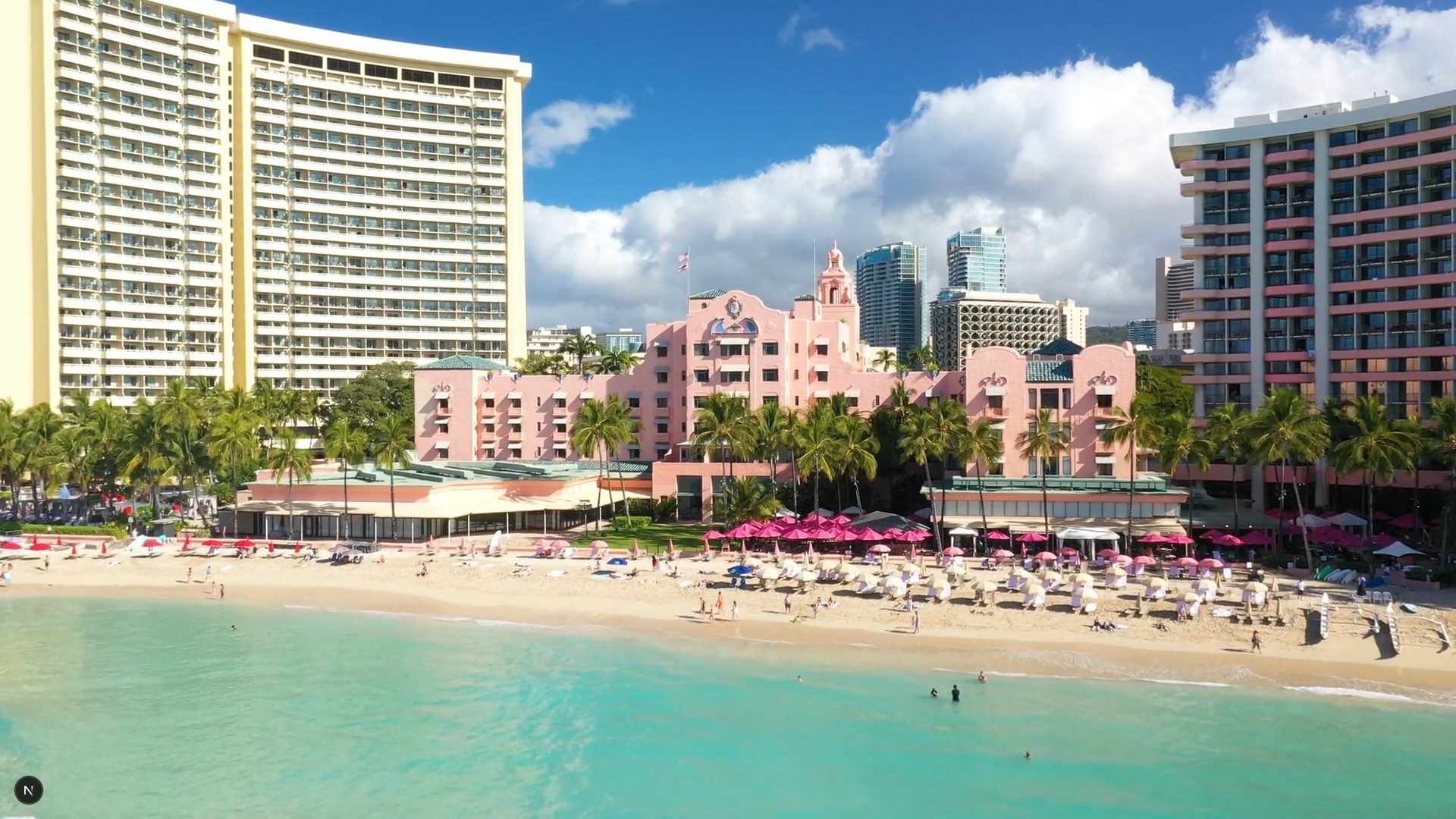 Beachfront hotels, palm trees and turquoise water