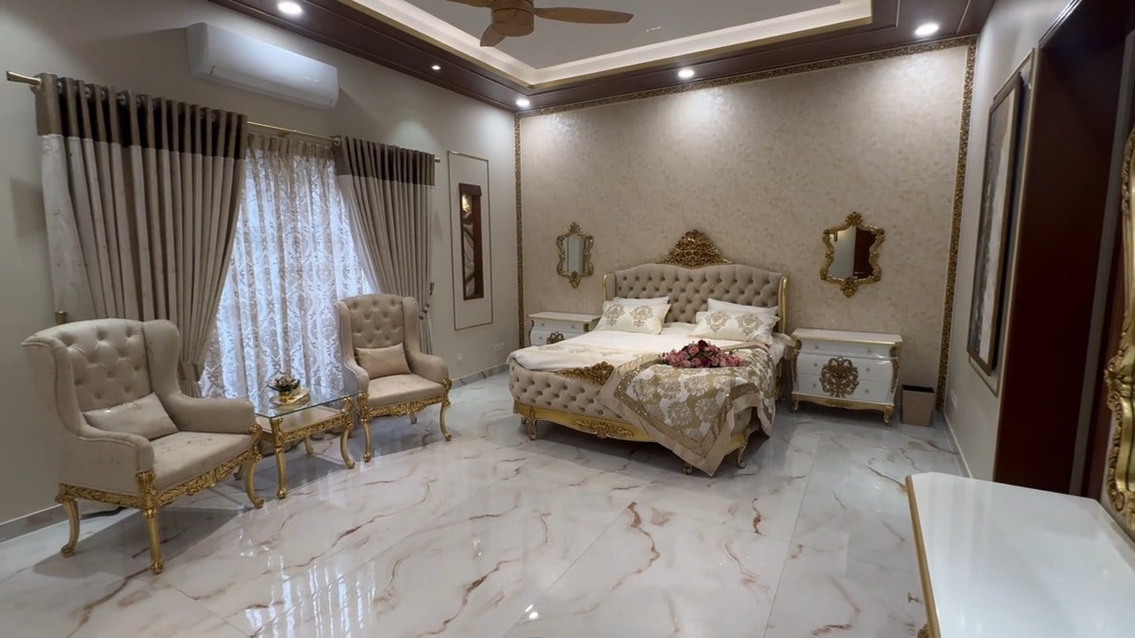 Video tour of a spacious bedroom with a king bed and seating area